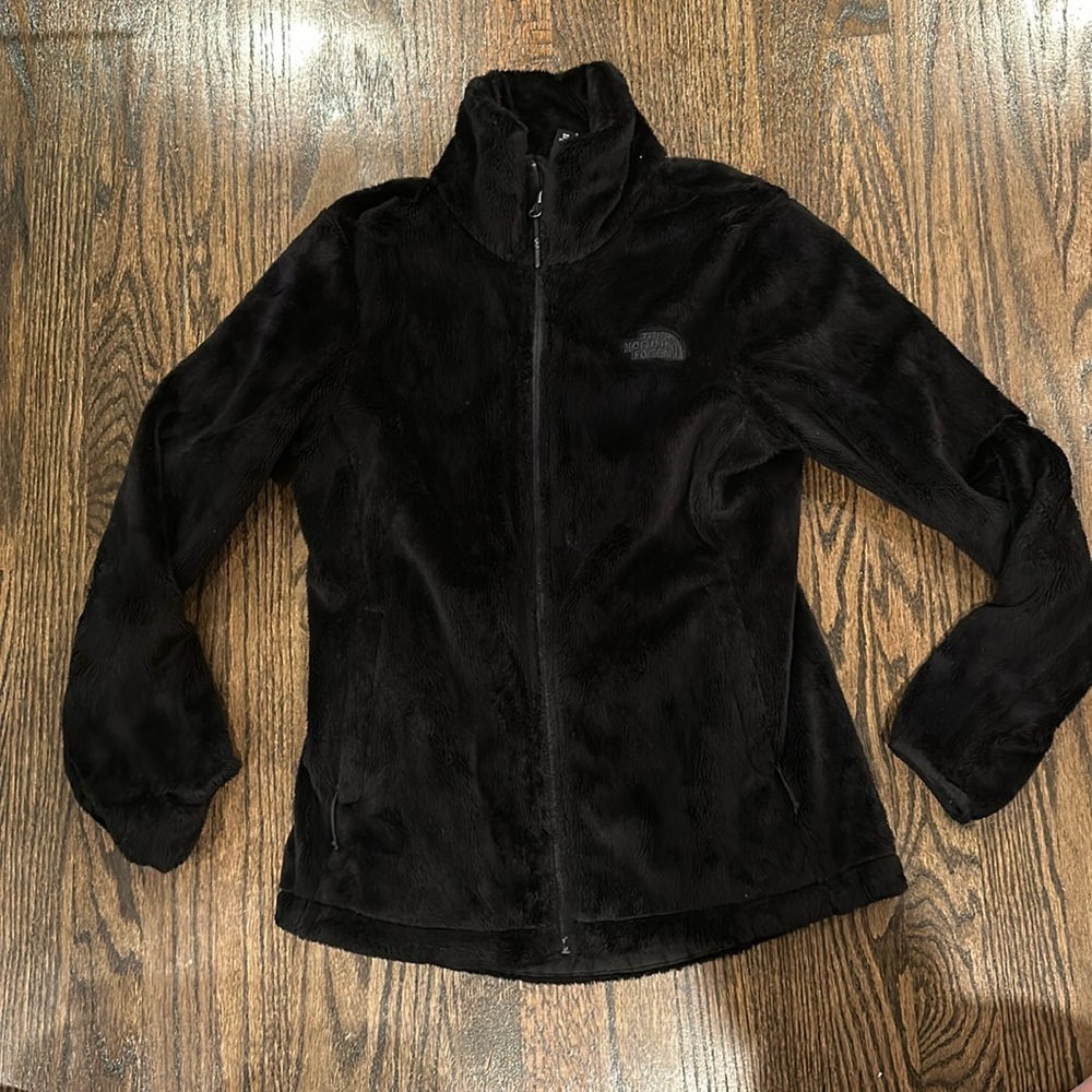 Northface. Like new, warm and fuzzy, clean. Price is firm and very fair.